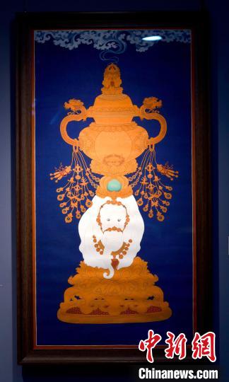 圖為5月16日，展覽中的新創(chuàng)唐卡作品《瑞象承香》?！±盍?攝